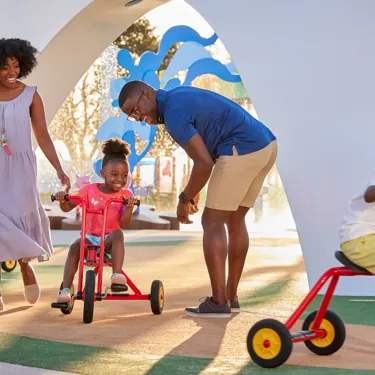 A family rides bikes at Peppa's Pedal Bike Tour